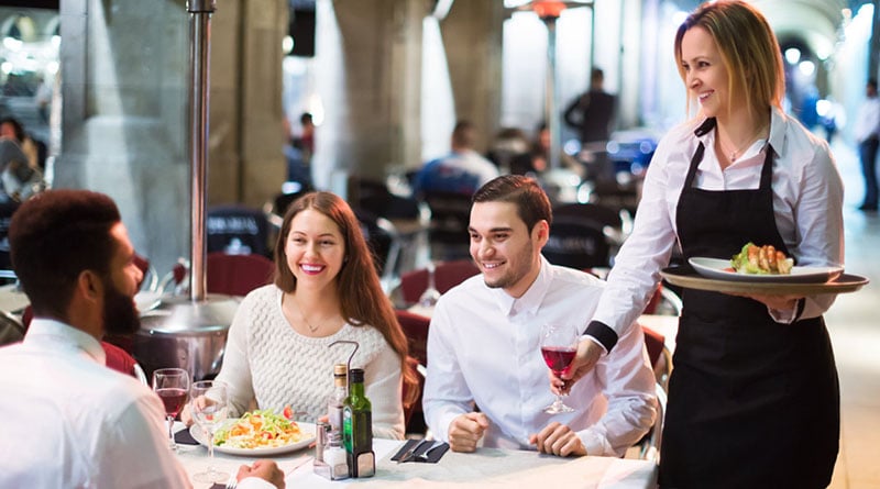 people have lunch at restaurant